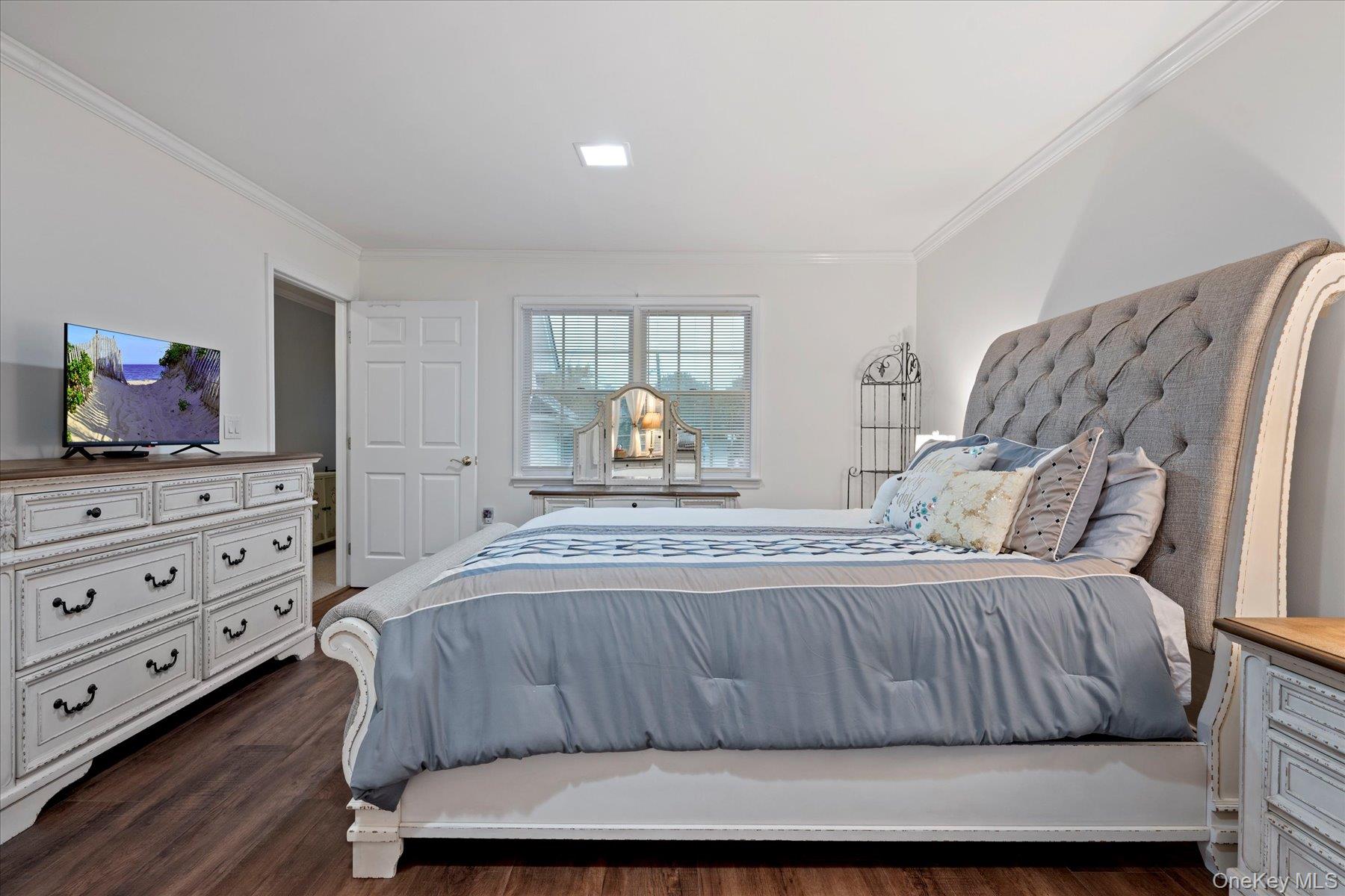 51 Marvin Street Patchogue, NY 11772 - Photo 17 of 25 a bedroom with a bed and dresser