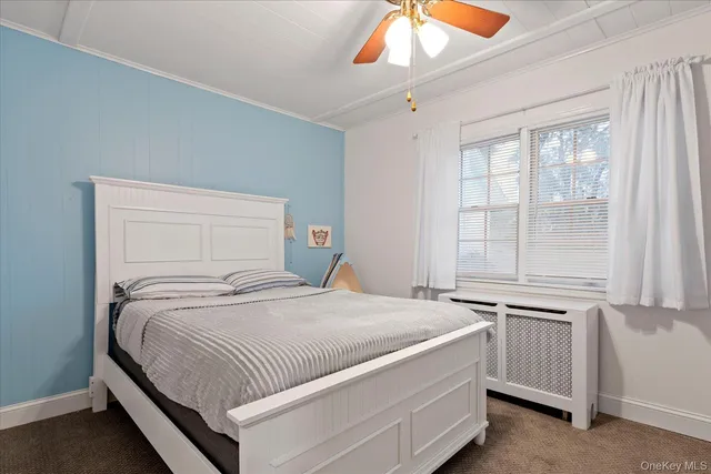 a room with a bed and a window