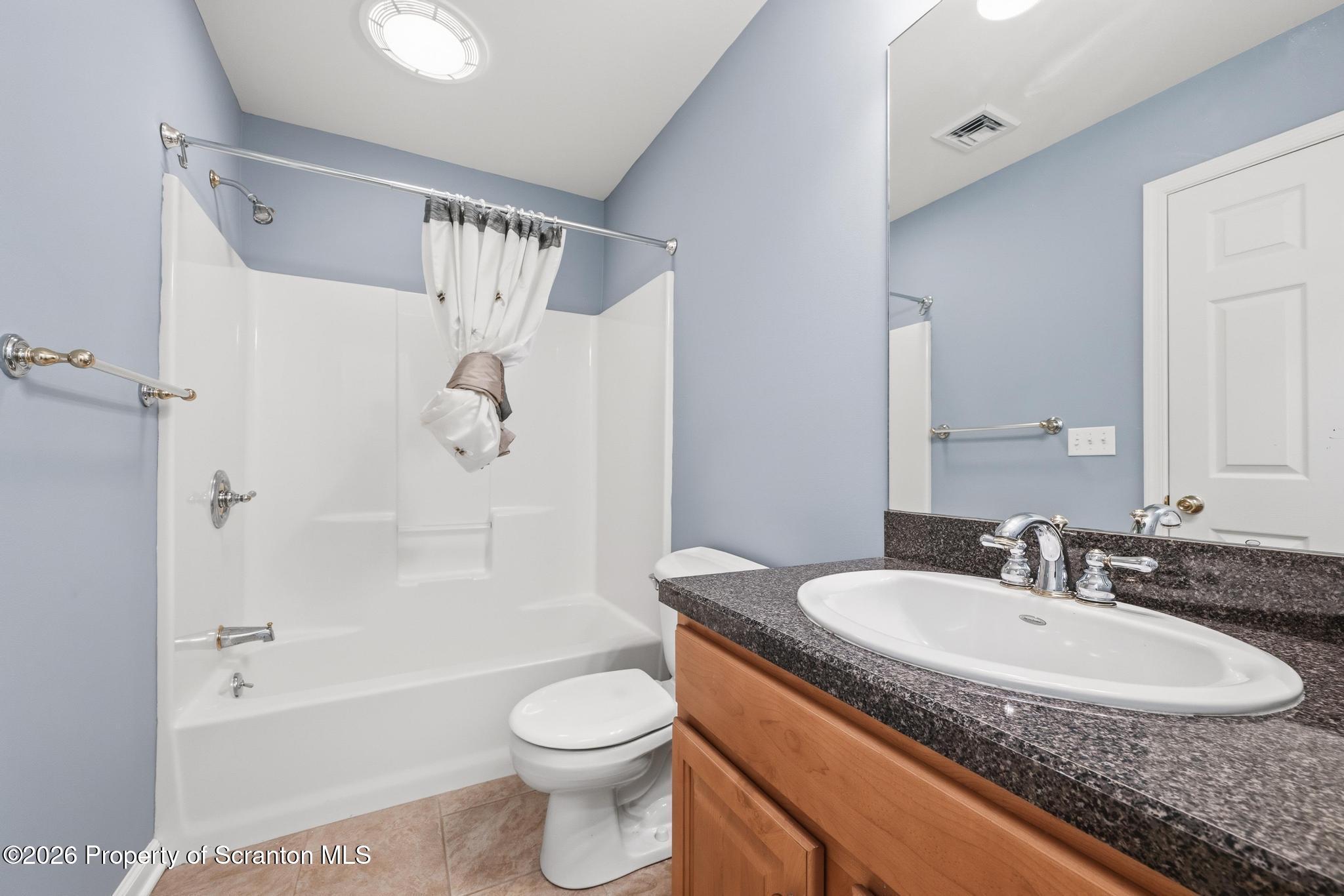 1502 Verne Cl Moosic, PA 18507 - Photo 28 of 46 a bathroom with a granite countertop sink a toilet and shower