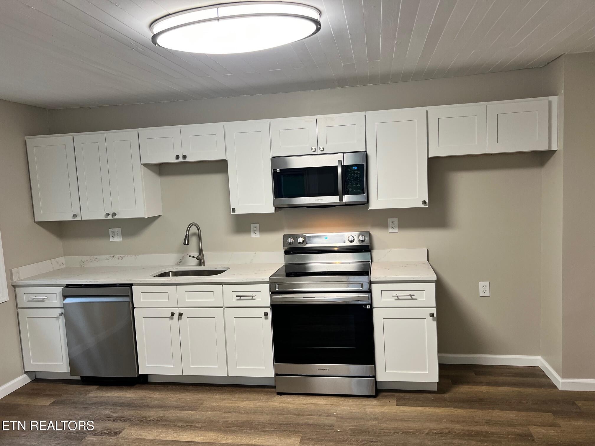 834 Cemetery Road Oliver Springs, TN 37840 - Photo 3 of 16 a kitchen with a stove and a sink