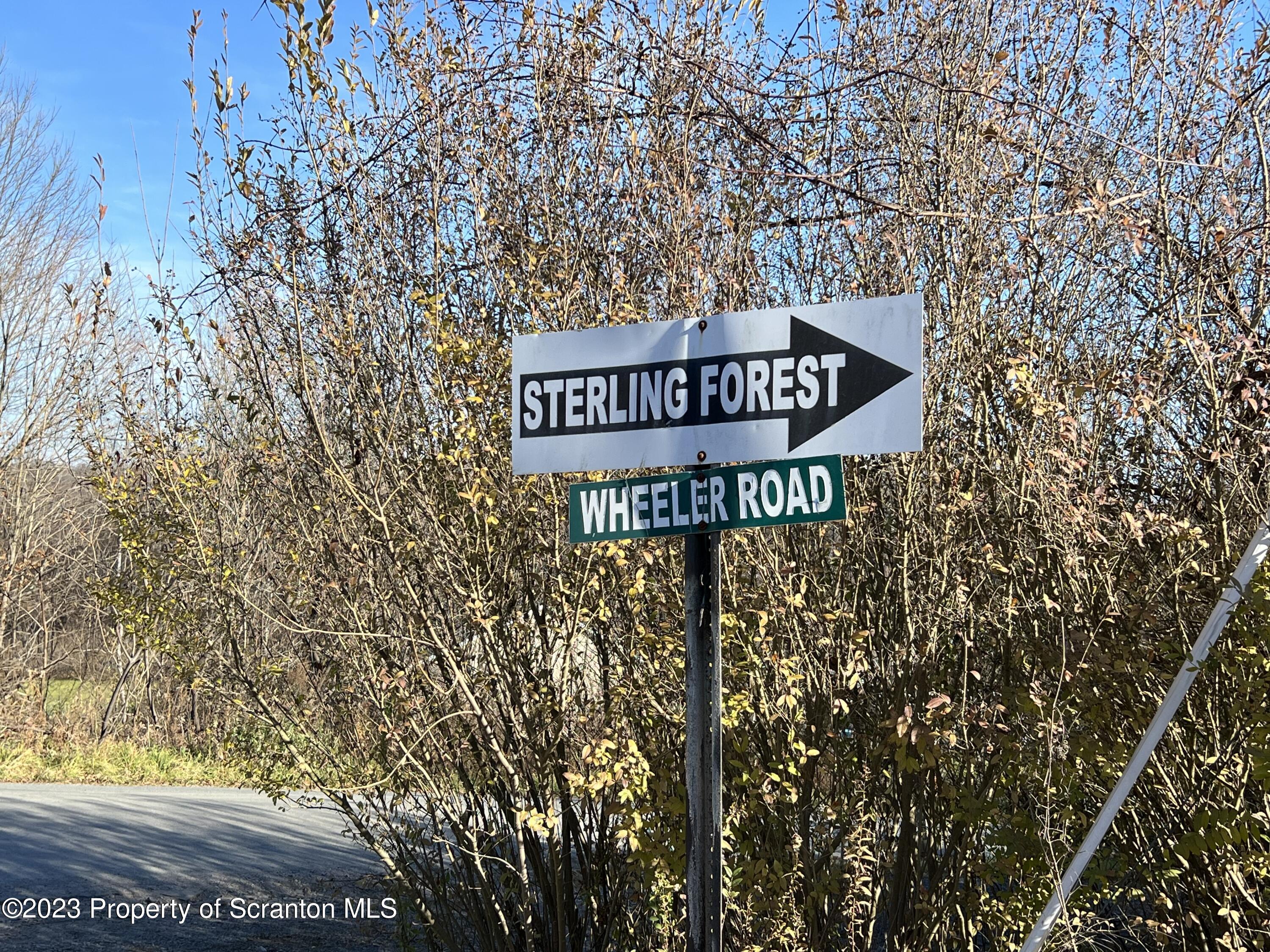 Elm Terrace Moscow, PA 18444 - Photo 3 of 6 a street sign on a pole on a street