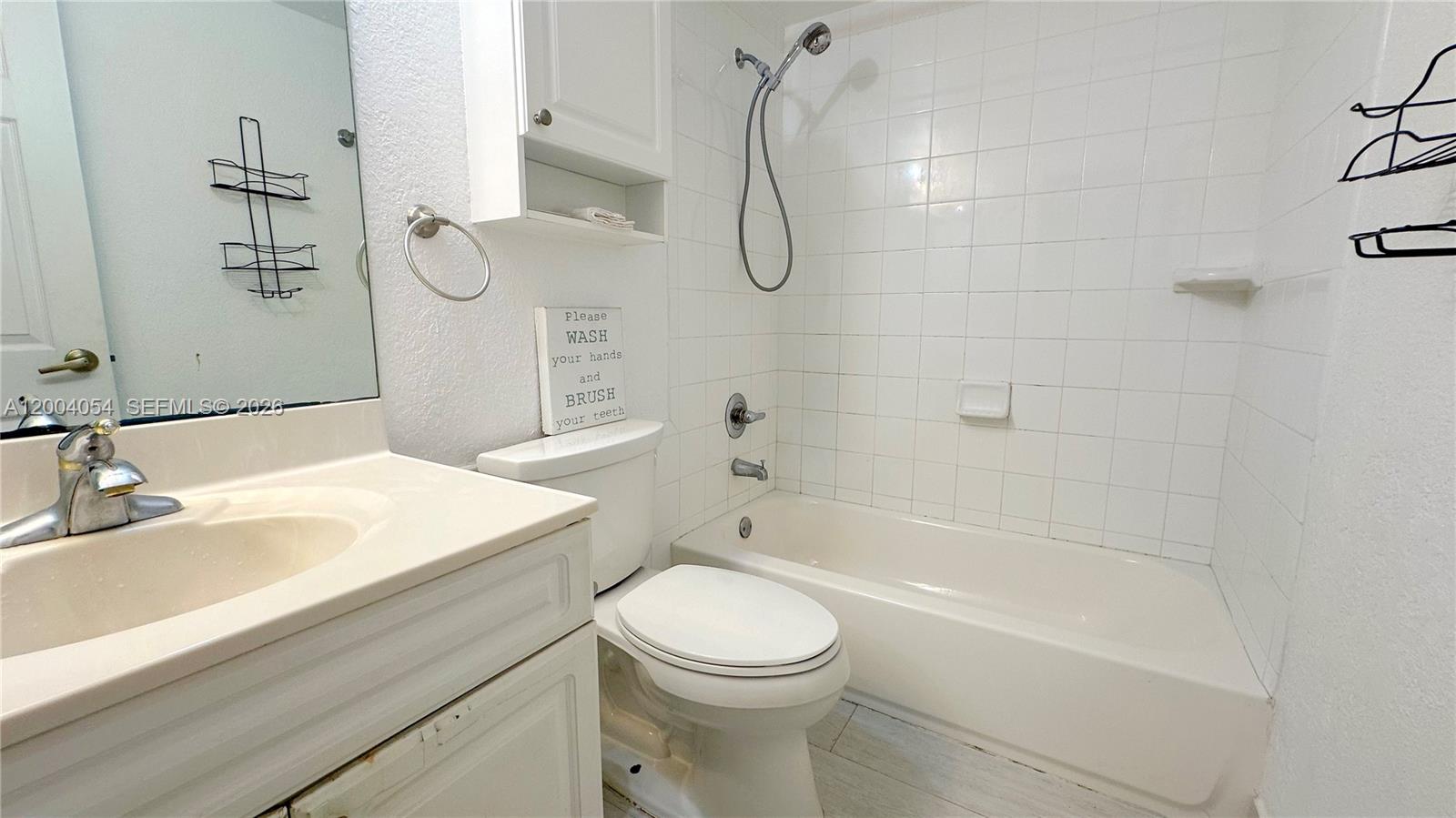 2501 South Ocean Drive, Unit 820 Hollywood, FL 33019 - Photo 12 of 12 a bathroom with a sink a toilet and shower