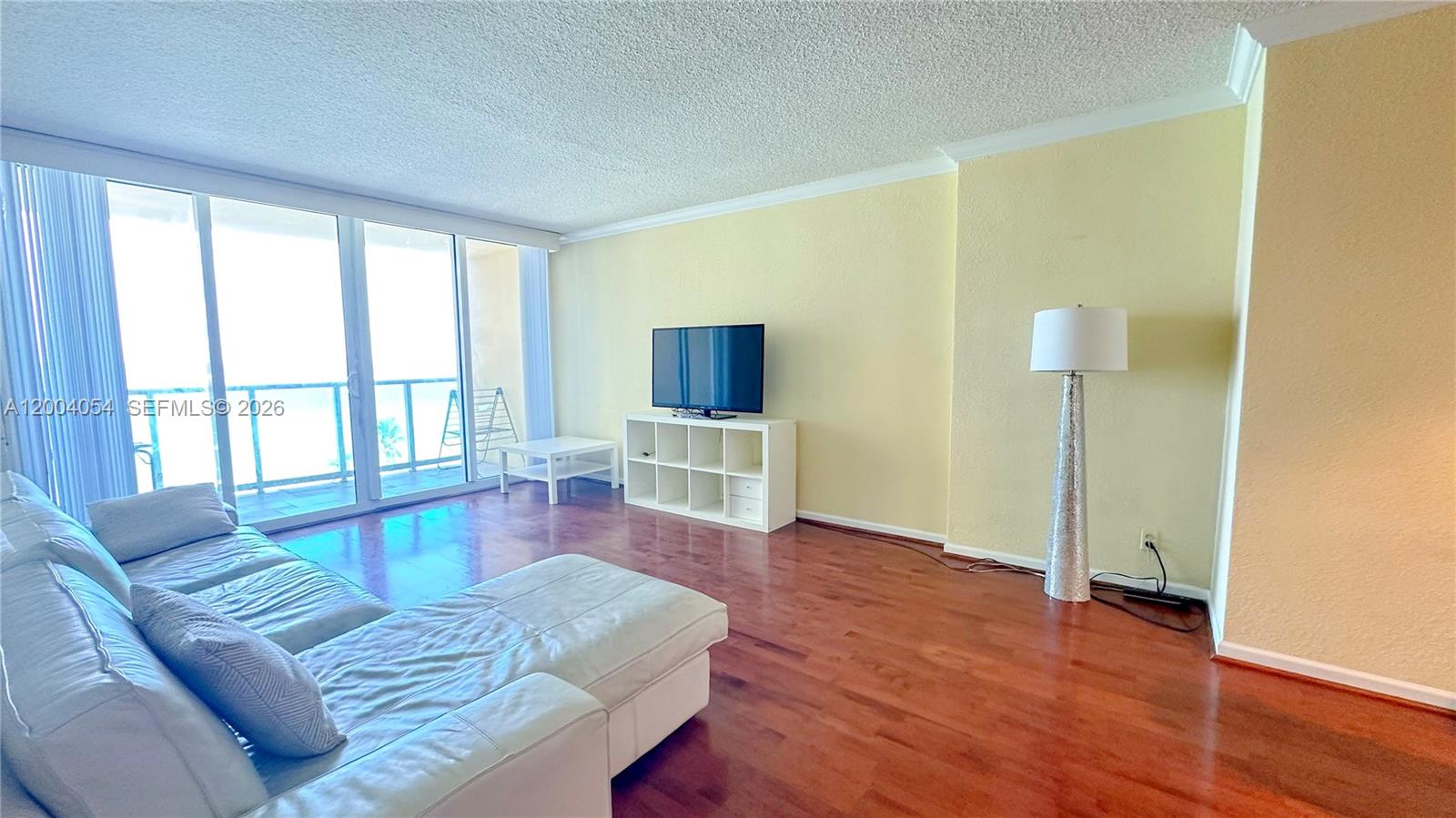 2501 South Ocean Drive, Unit 820 Hollywood, FL 33019 - Photo 3 of 12 a living room with furniture and a flat screen tv