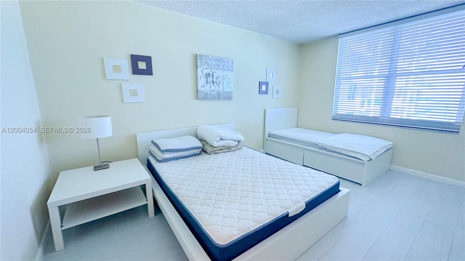 2501 South Ocean Drive, Unit 820 Hollywood, FL 33019 - Photo 5 of 12 a bed room with a bed and a chair