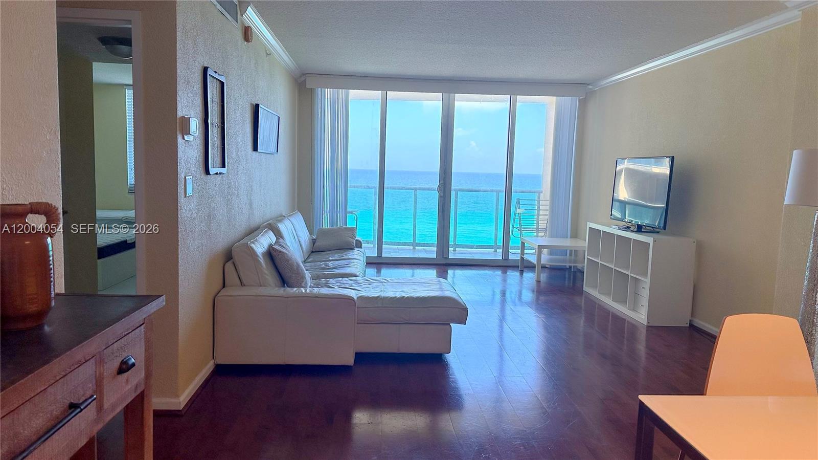 2501 South Ocean Drive, Unit 820 Hollywood, FL 33019 - Photo 9 of 12 a living room with furniture and a large window