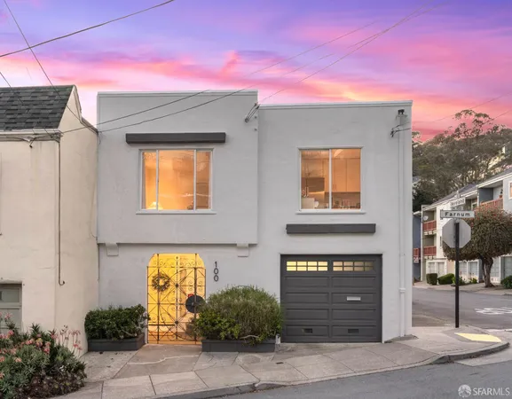 a front view of a house with a garage