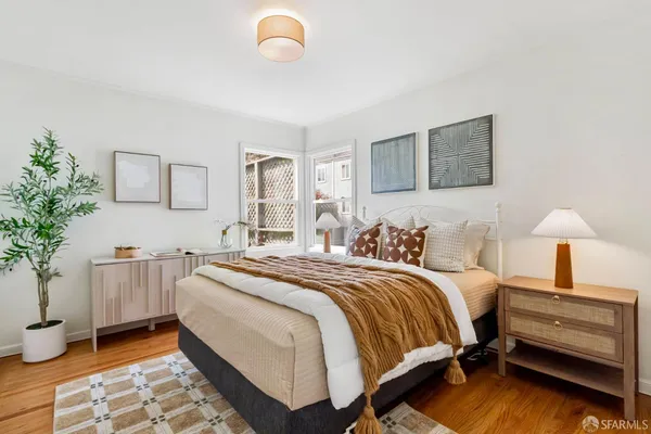 a bedroom with a bed and a book shelf