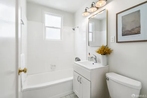a utility room with multiple racks and a painting on the wall