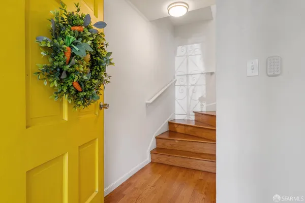 a view of entryway with wooden floor