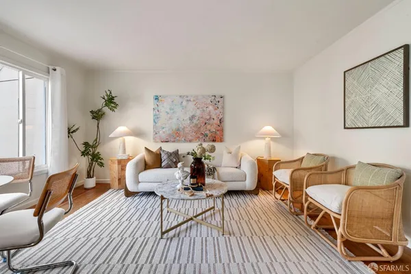 a spacious bedroom with a bed and a couch