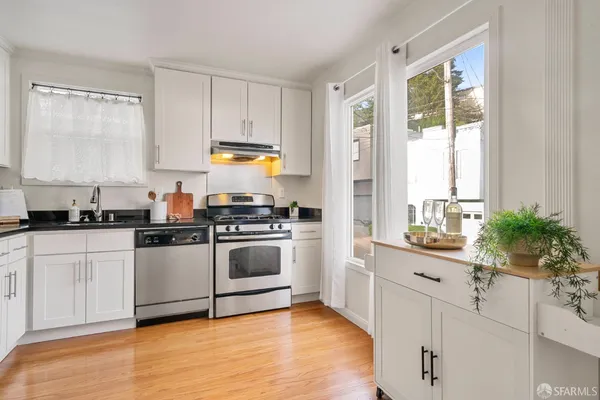 a kitchen with a sink and cabinets