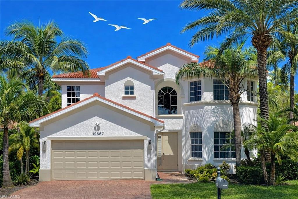 12667 Biscayne Court Naples, FL 34105 - Photo 1 of 39 a front view of a house with a yard
