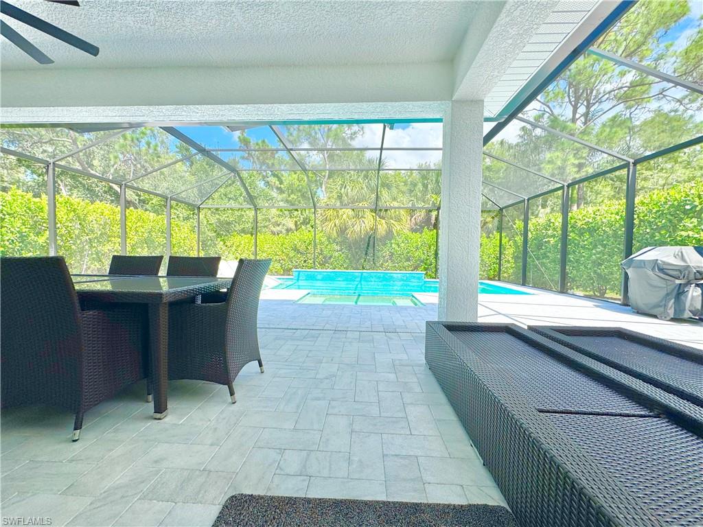 12667 Biscayne Court Naples, FL 34105 - Photo 31 of 39 a view of a porch with furniture and yard