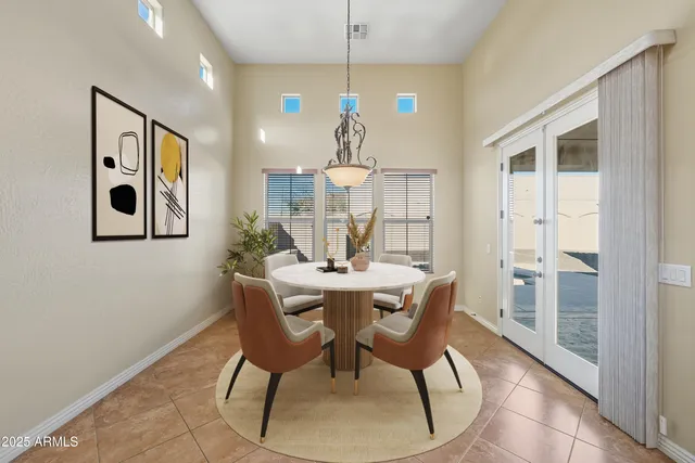 a dining room with furniture and window