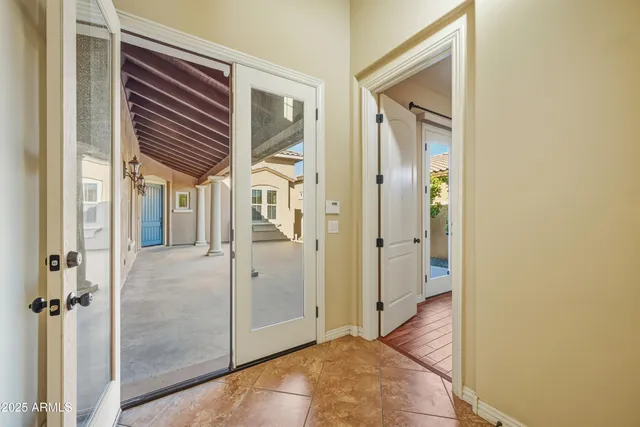 a view of a hallway with wooden floor and closet