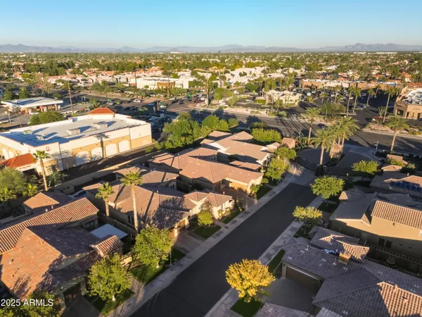 an aerial view of residential houses with outdoor space