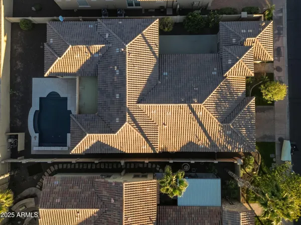 an aerial view of a house with a ocean view