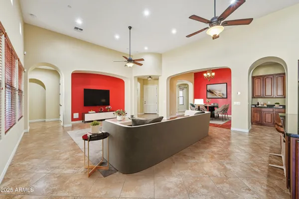 a living room with fireplace furniture and a flat screen tv