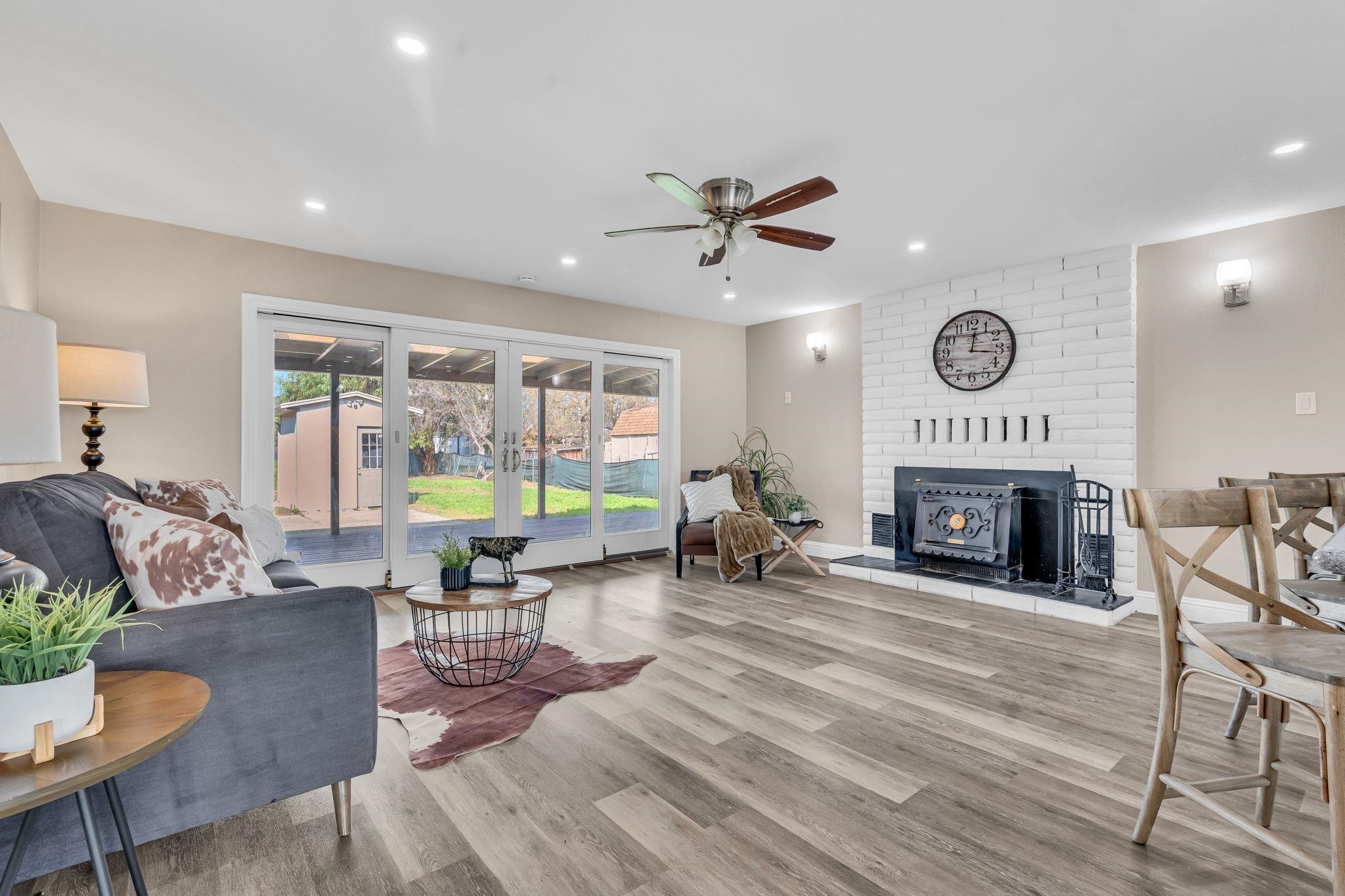 1660 Sunset Road Brentwood, CA 94513 - Photo 14 of 45 Living room with light wood finished floors, ceiling fan, recessed lighting, and a fireplace