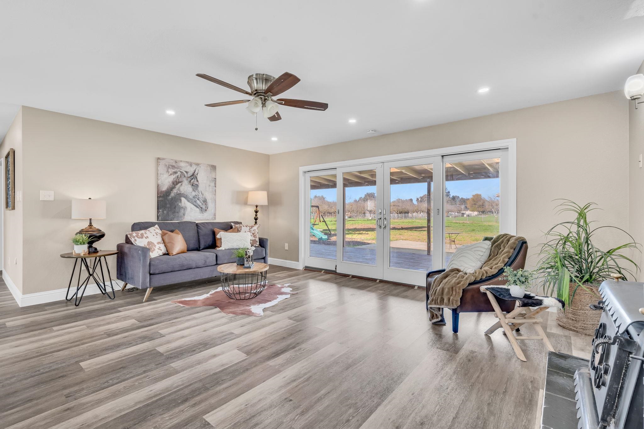 1660 Sunset Road Brentwood, CA 94513 - Photo 15 of 45 Living room featuring french doors, a ceiling fan, dark wood finished floors, and recessed lighting
