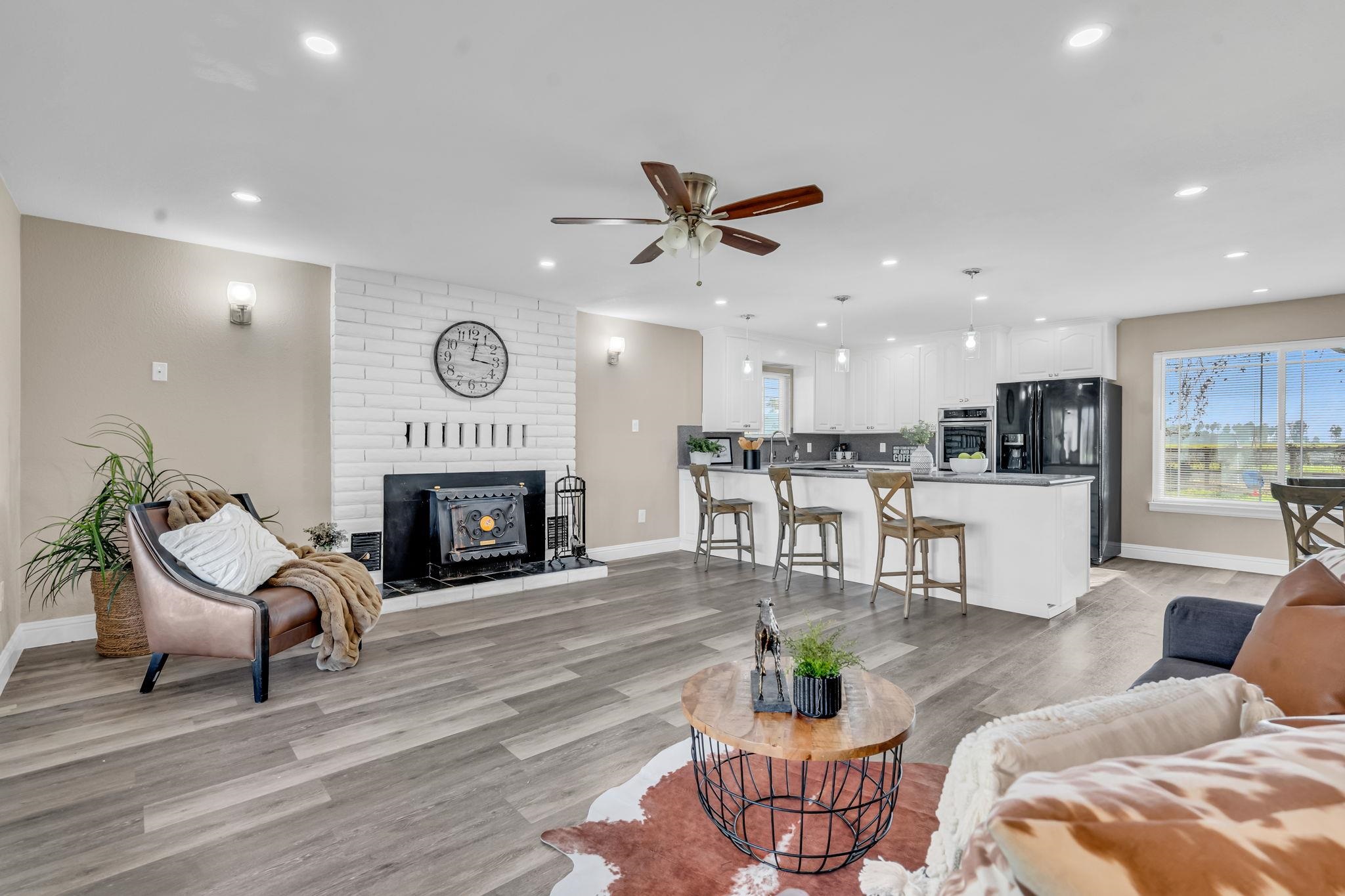 1660 Sunset Road Brentwood, CA 94513 - Photo 17 of 45 Living room with light wood-style floors, a fireplace, ceiling fan, recessed lighting, and plenty of natural light