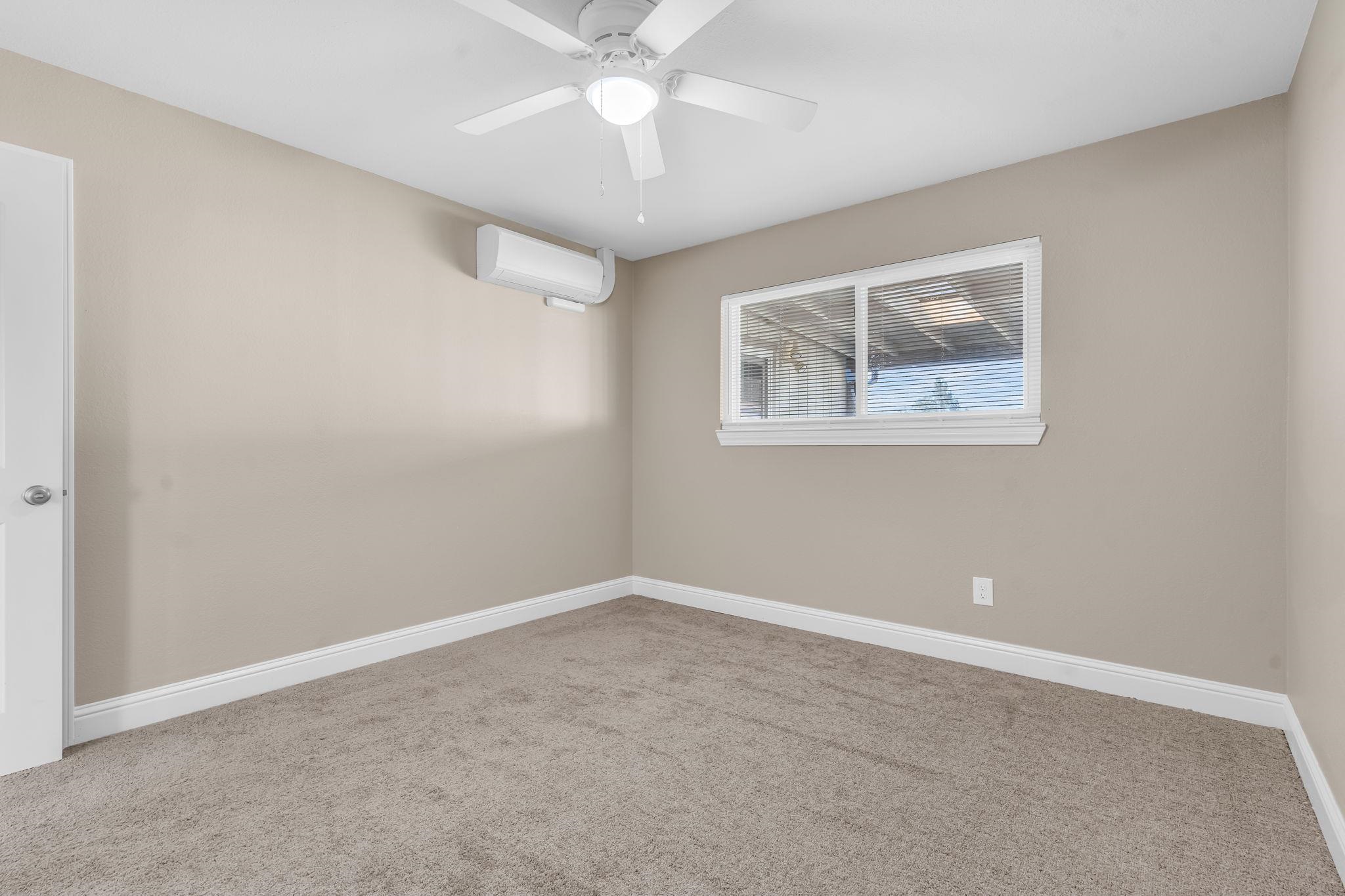1660 Sunset Road Brentwood, CA 94513 - Photo 20 of 45 Carpeted spare room with a mini split for heating / cooling and a ceiling fan