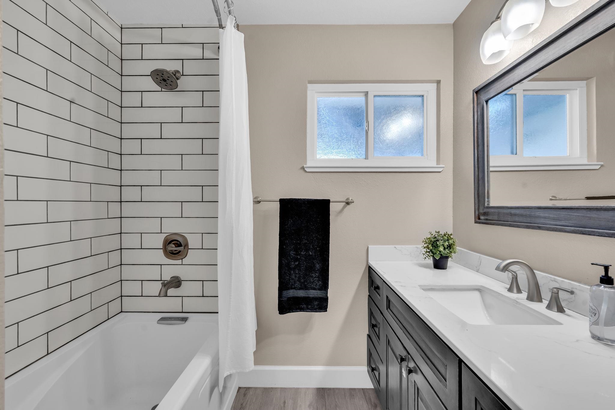 1660 Sunset Road Brentwood, CA 94513 - Photo 23 of 45 Bathroom with shower / tub combo with curtain, vanity, and light wood-style flooring