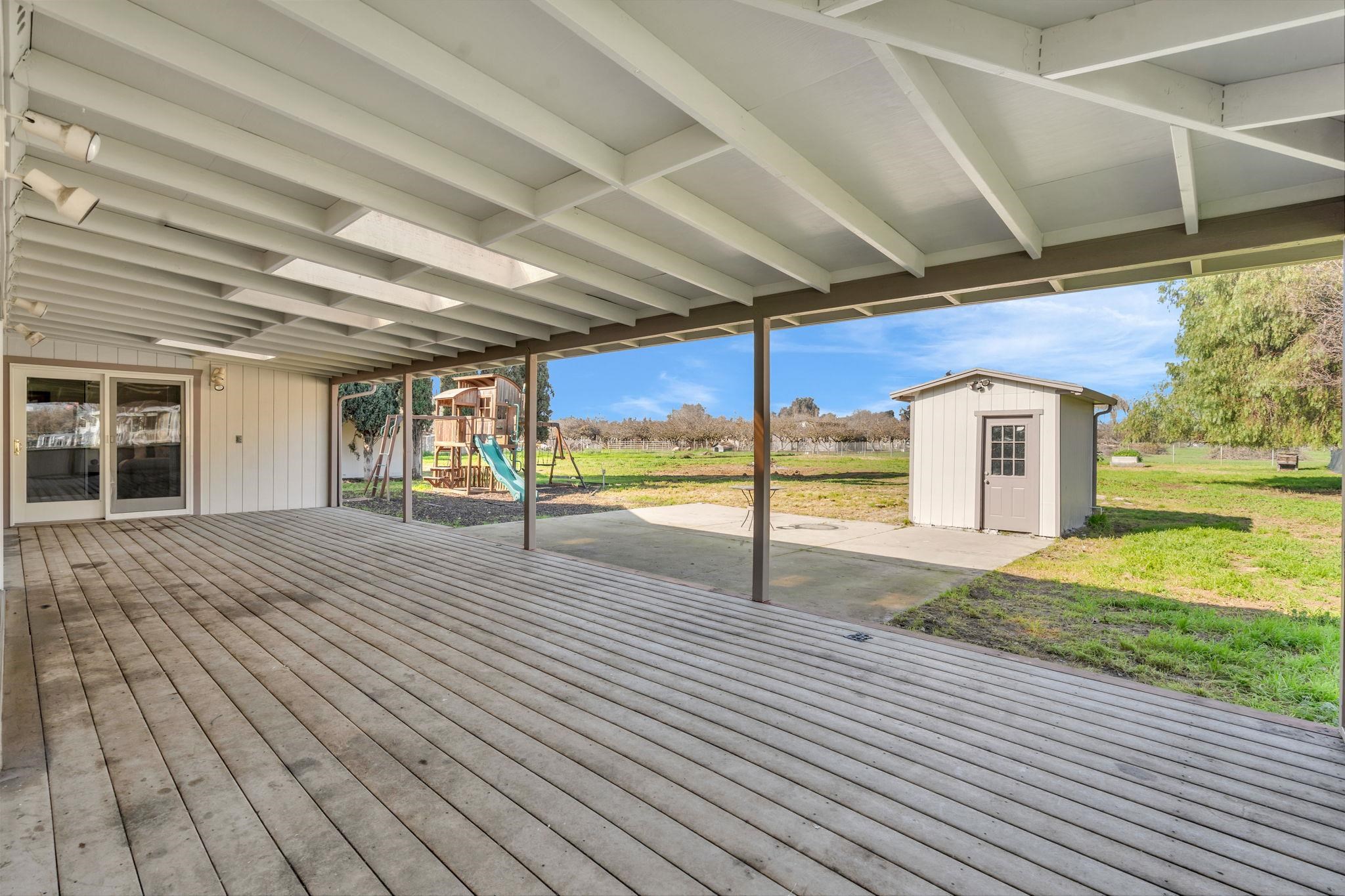 1660 Sunset Road Brentwood, CA 94513 - Photo 34 of 45 Deck with a playground, a storage shed, a yard, and a patio area