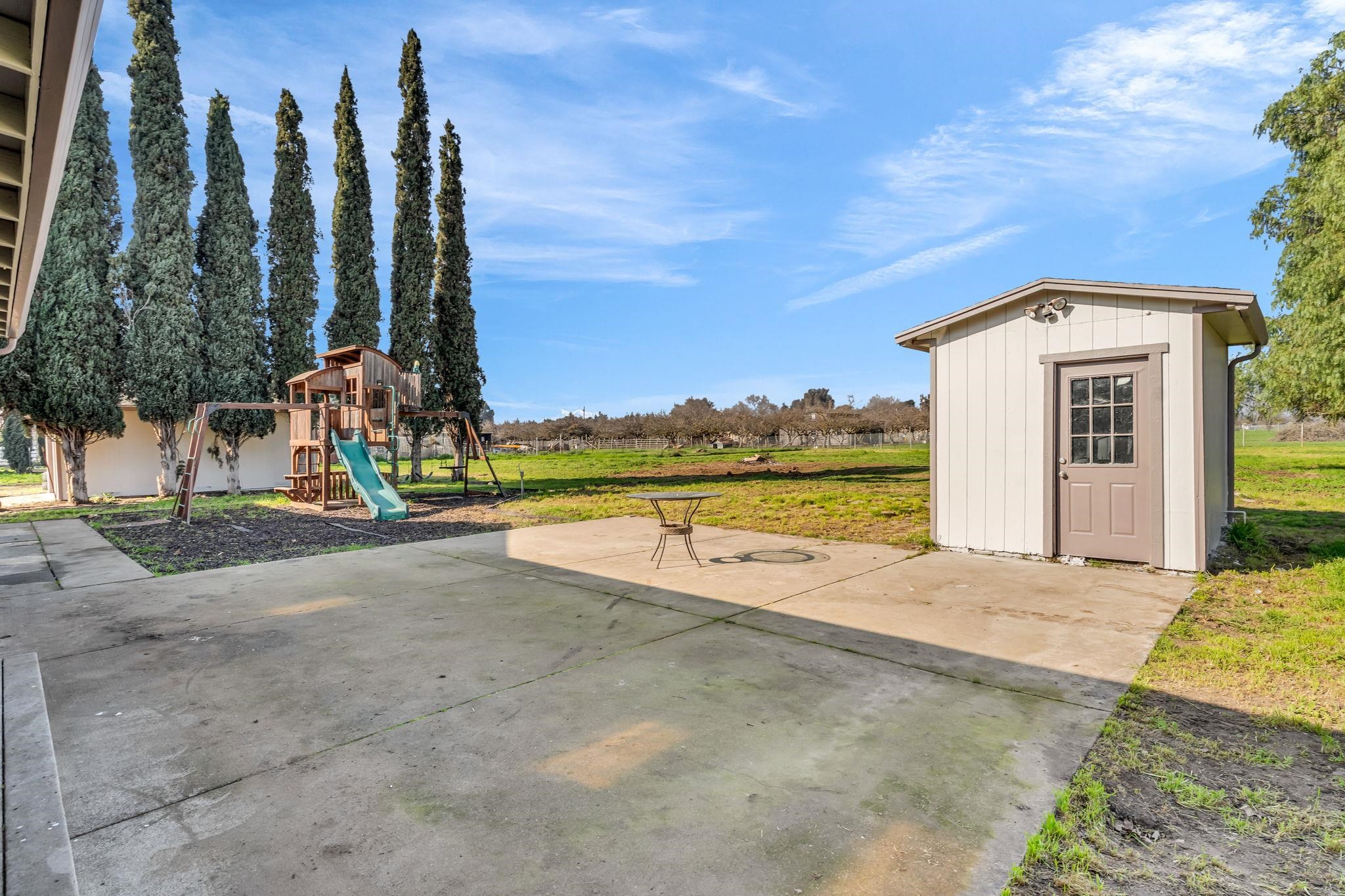 1660 Sunset Road Brentwood, CA 94513 - Photo 35 of 45 View of patio / terrace with a playground and a storage shed