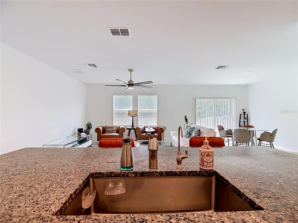 1633 Red Loop Lakeland, FL 33801 - Photo 5 of 60 a view of a living room and kitchen
