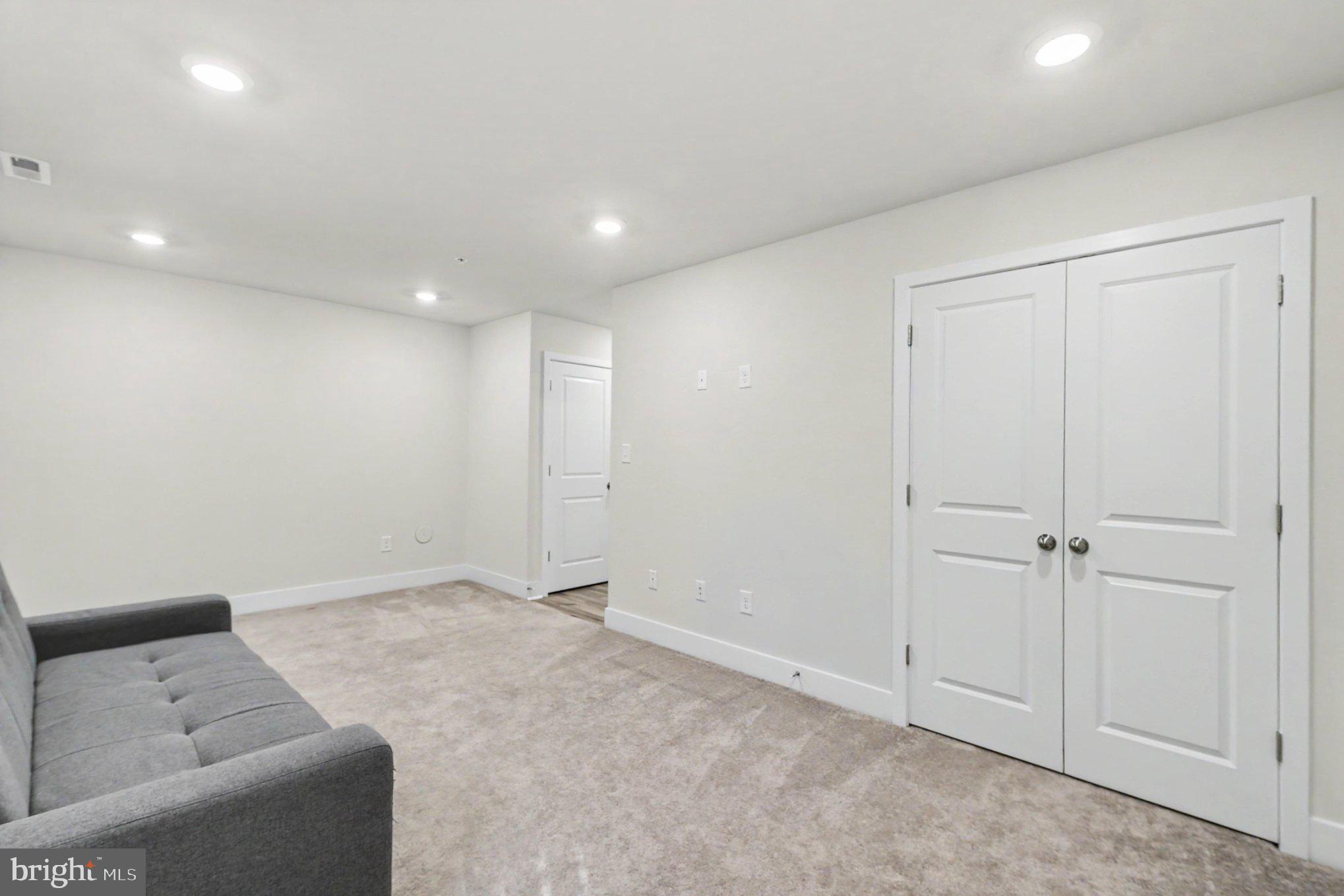 238 Waterstone Road Essex, MD 21221 - Photo 8 of 39 a view of room with a ceiling fan and couch