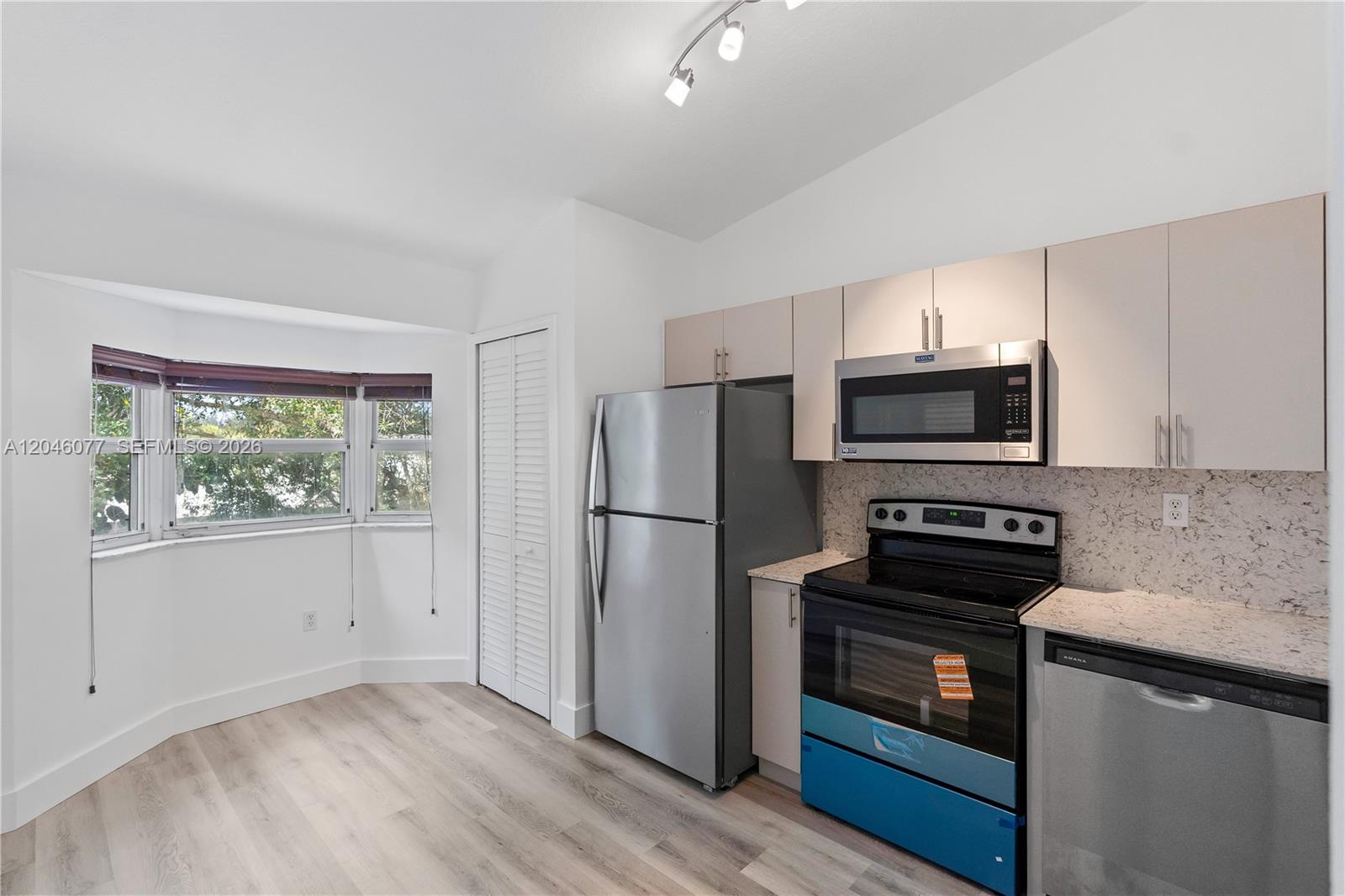 2930 Southeast 12th Road, Unit 20431 Homestead, FL 33035 - Photo 20 of 37 a kitchen with a refrigerator stove and microwave