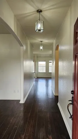 a view of gallery with wooden floor