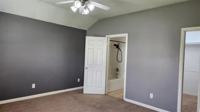 an empty room with a bathroom