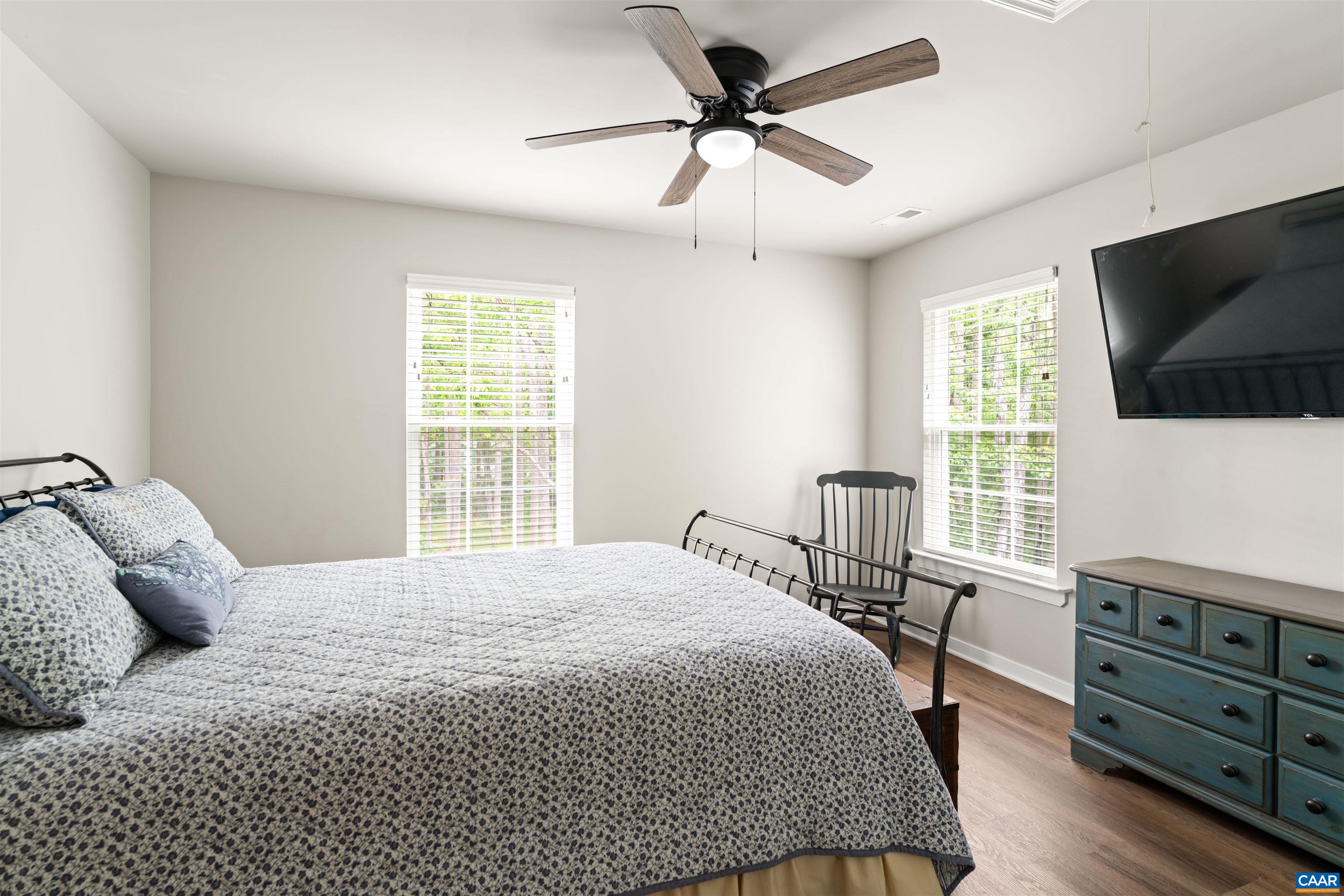 1760 Haden Martin Road Palmyra, VA 22963 - Photo 40 of 51 a bedroom with a bed a flat screen tv and a window