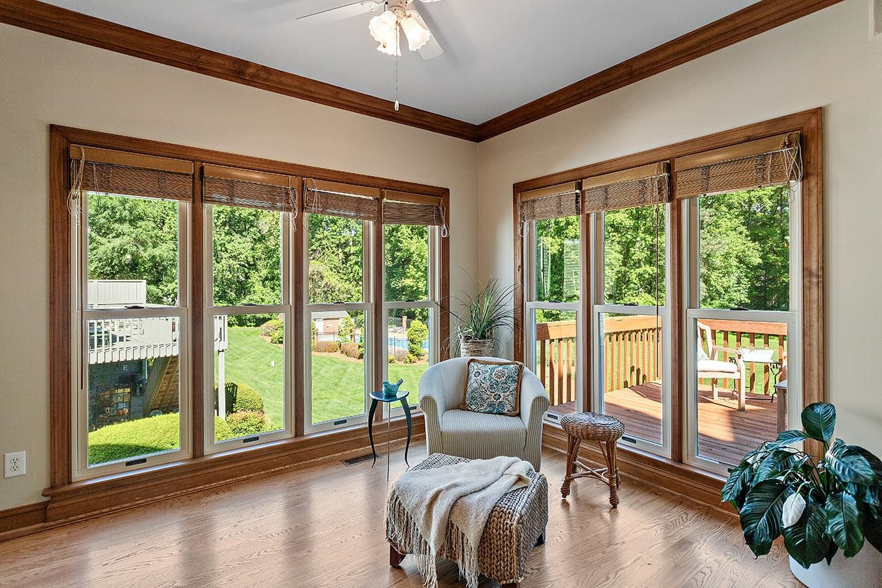 2315 Upper Oaks Way Raleigh, NC 27615 - Photo 13 of 45 Two walls of windows showcase the sunroom that overlooks the backyard Sunroom