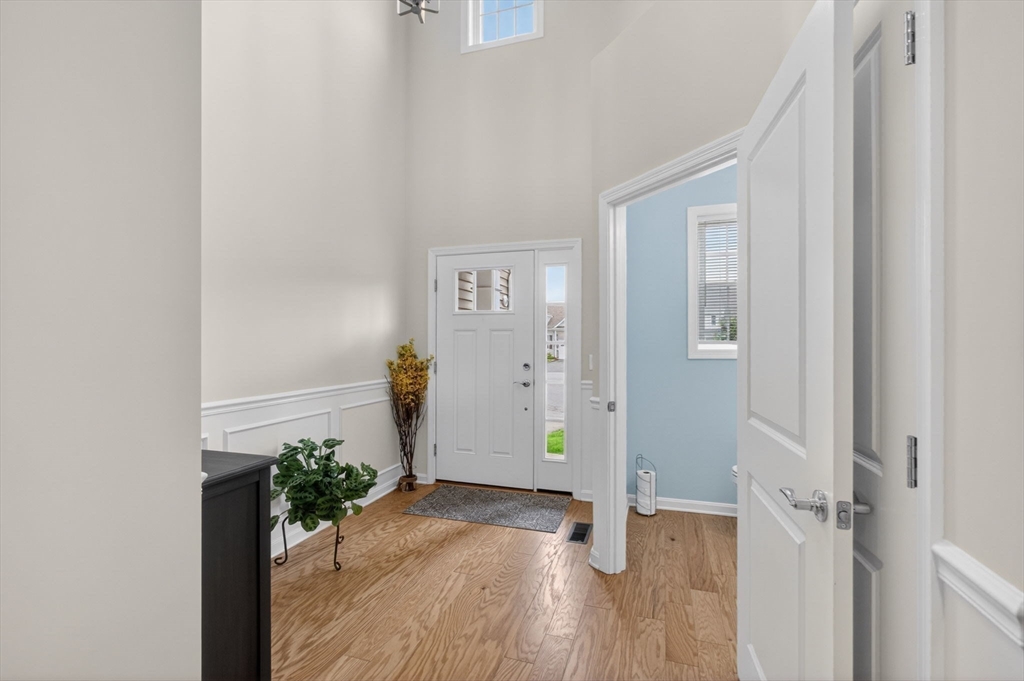 87 Shannon Way, Unit 86 Upton, MA 01568 - Photo 29 of 36 a view of entryway with wooden floor