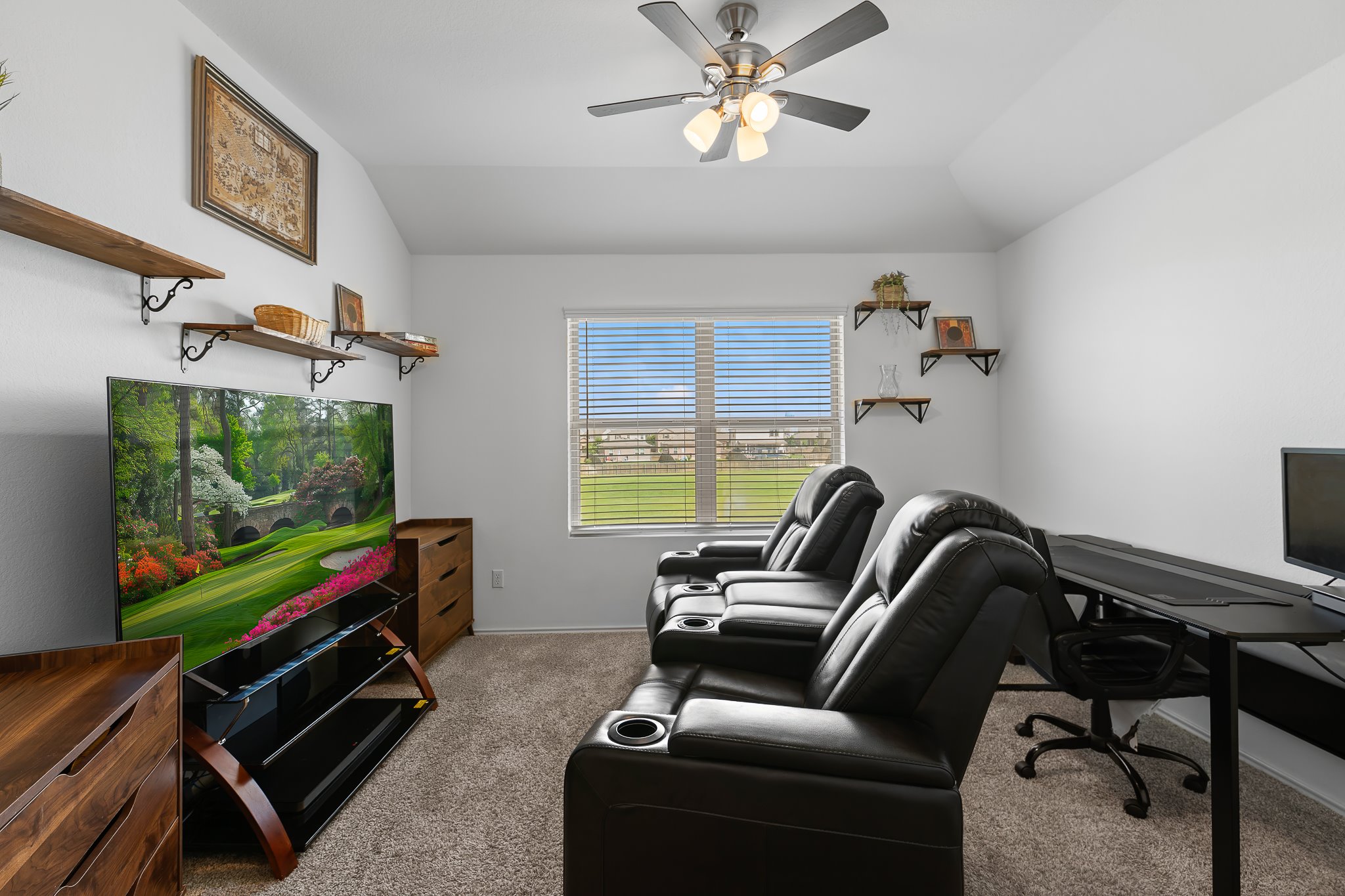 576 Greatest Gift Way Jarrell, TX 76537 - Photo 20 of 37 Relax in this comfortable space with ample seating and a well-lit environment for entertainment or work.