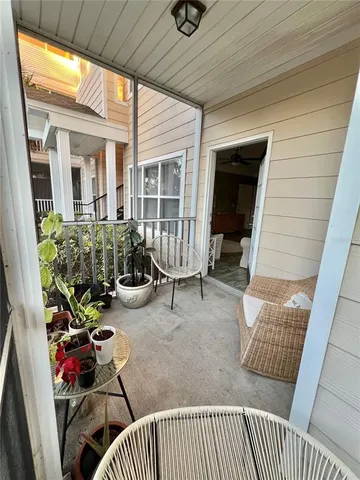 a living room with couch and a floor to ceiling window