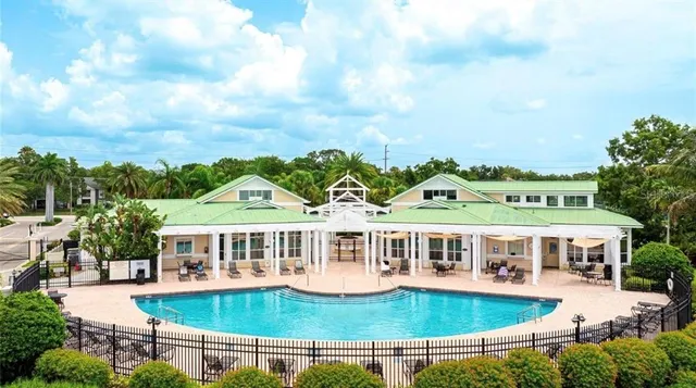 a view of a lake with a house in the background