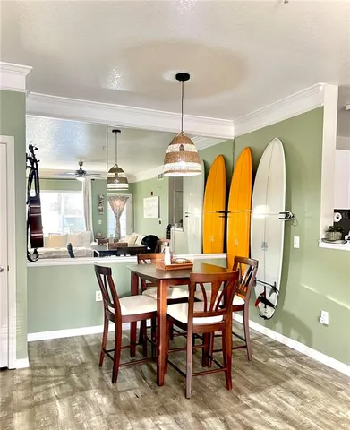 a dining room with furniture a chandelier and a rug