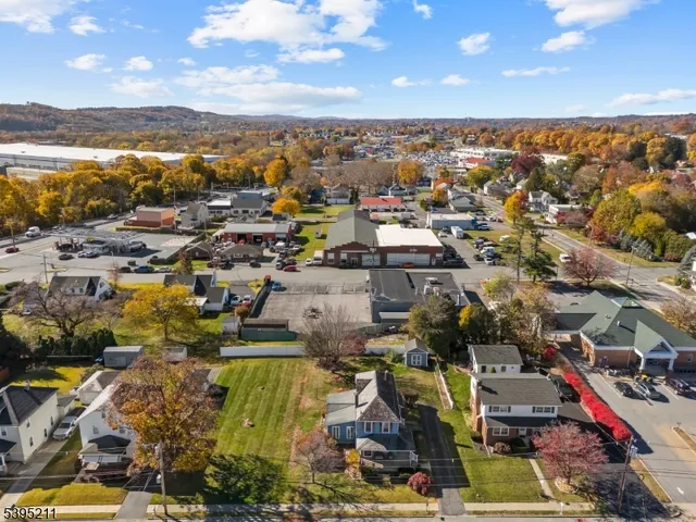 an aerial view of residential building and ocean view
