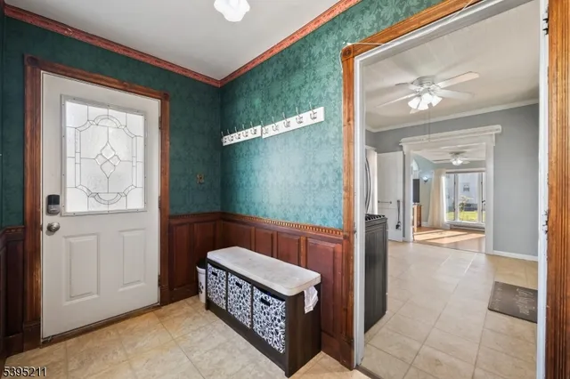 a view of a bedroom with wooden floor and a hallway