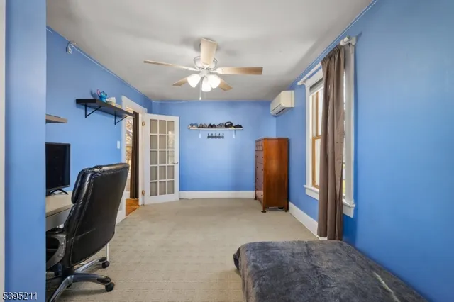 a bedroom with a bed and a chair