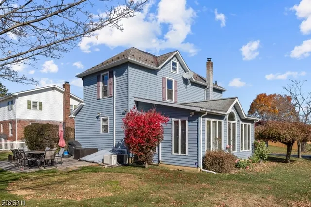 a front view of a house with a yard balcony