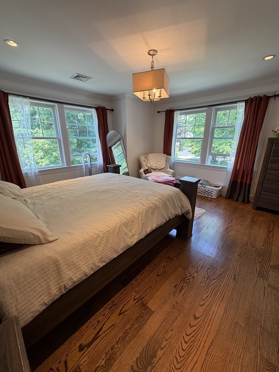 17 Cardinal Street, Unit 17 Winchester, MA 01890 - Photo 15 of 42 a bedroom with a bed and a large window