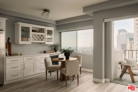 a view of a dining room with furniture window and outside view