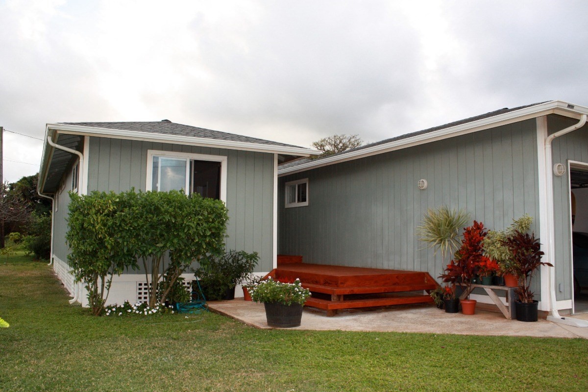 341 Eggerking Road, Unit 1 Kapaa, HI 96746 - Photo 1 of 10 a front view of a house with a yard