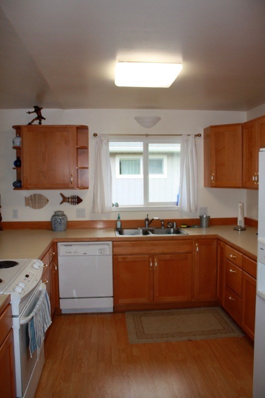 341 Eggerking Road, Unit 1 Kapaa, HI 96746 - Photo 2 of 10 a kitchen with stainless steel appliances granite countertop a sink and a stove