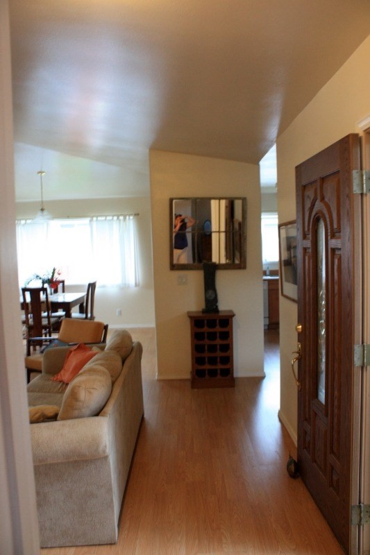 341 Eggerking Road, Unit 1 Kapaa, HI 96746 - Photo 7 of 10 a living room with furniture and a flat screen tv